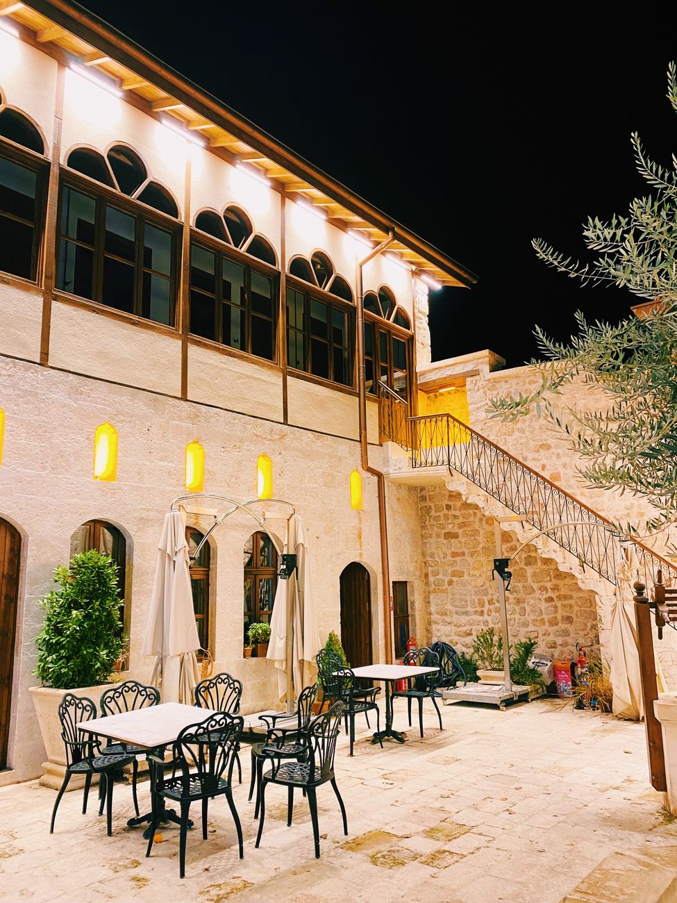 Intimate culinary dining setting in a restored stone courtyard