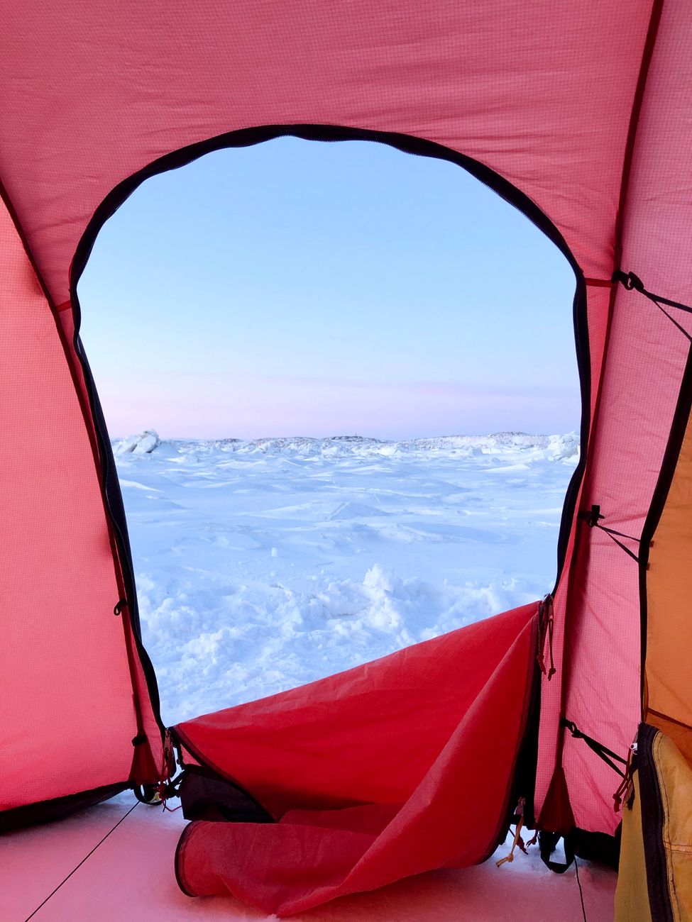 Expedition tent overlooking an arctic sunrise